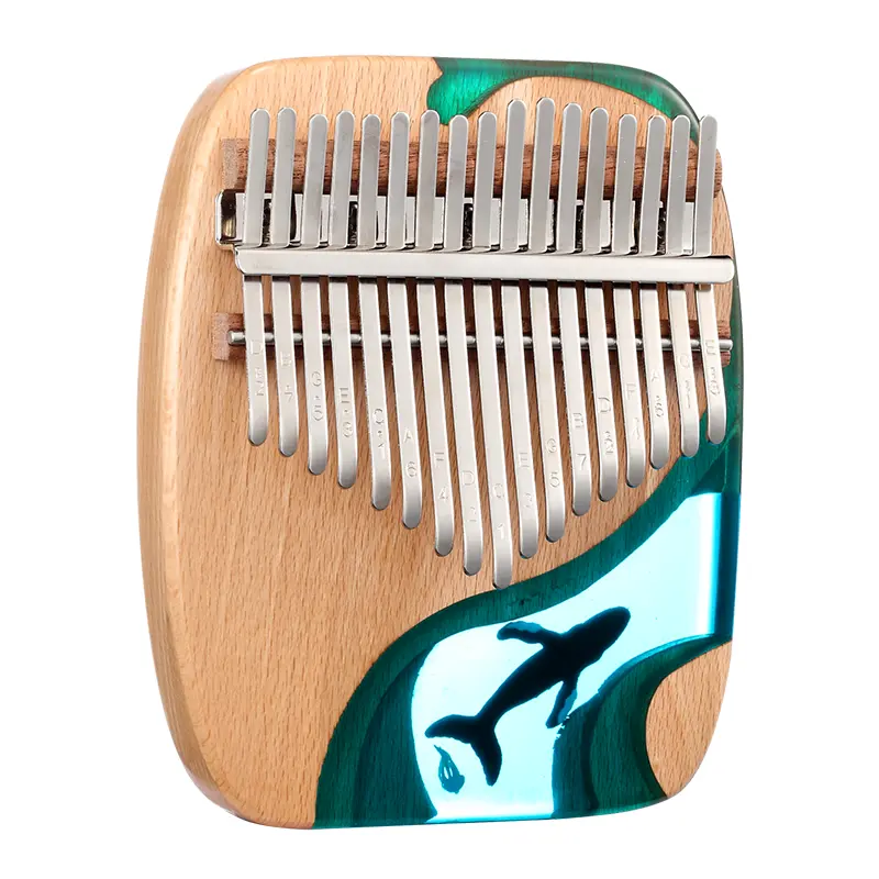A 17 key Kalimba with an arc-shaped body made from beechwood and epoxy resin. The resin section depicts an underwater scene with a Blue Whale.