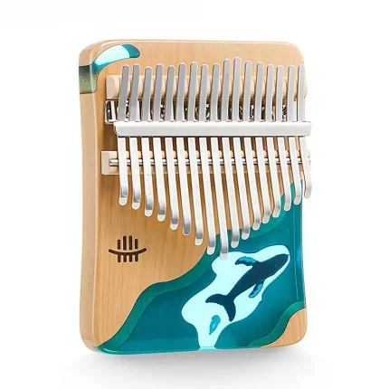 Studio shot of Hluru 21 key kalimba with ocean whale resin inlay and light wood body