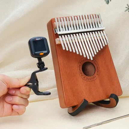 Kalimba clip-on tuner attached to a Kalimba instrument for tuning