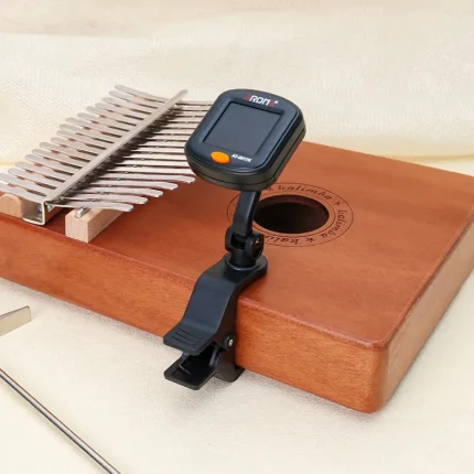 Kalimba clip-on tuner clipped on the side of Kalimba instrument