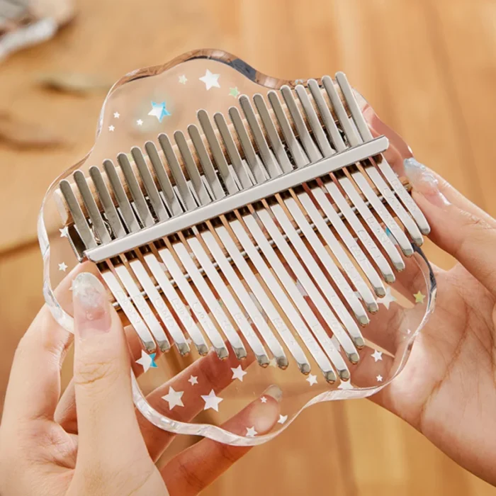 A 21-key transparent acrylic kalimba with a petal outline and star decorations from HUASHU.