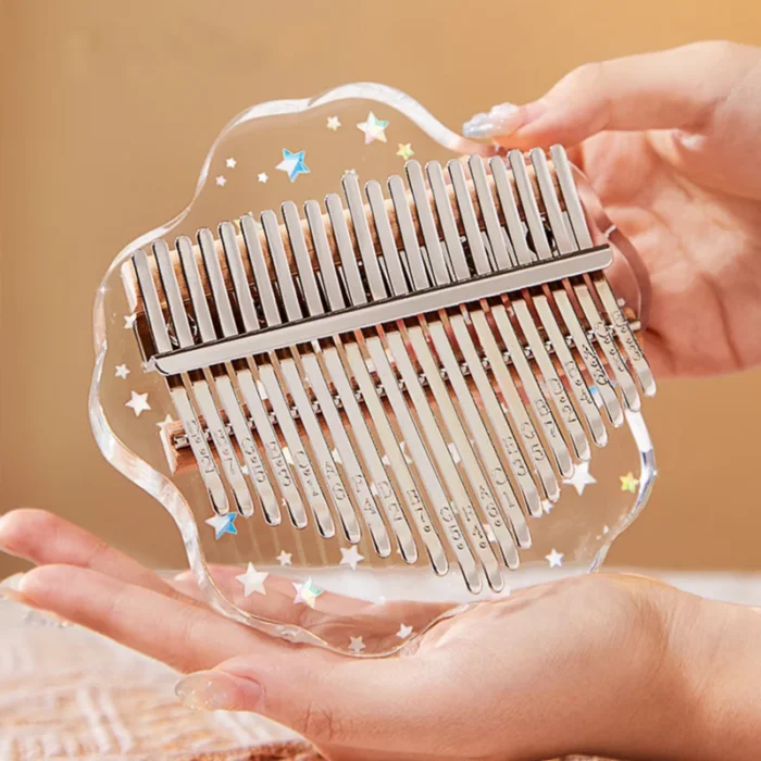 A handheld transparent petal-shaped acrylic kalimba with 21 keys from HUASHU’s Starry Series.